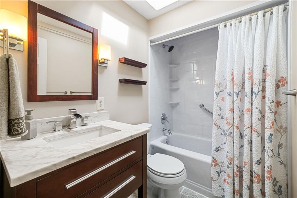 1335 Alamae Lakes Road Washington, PA 15301 - Photo 29 of 50 a bathroom with a granite countertop sink toilet and shower