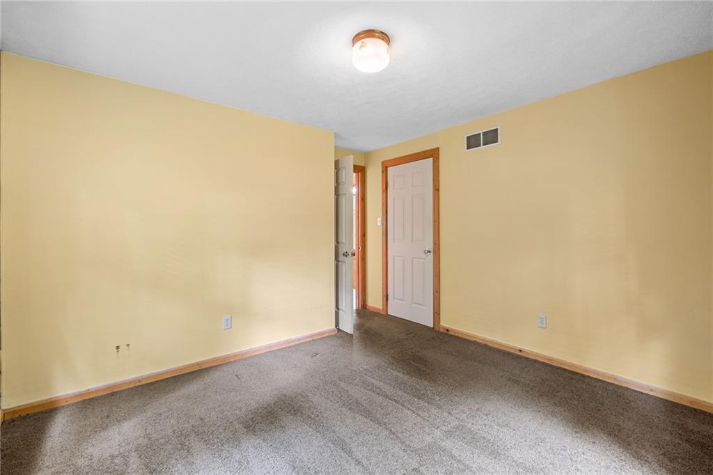 1335 Alamae Lakes Road Washington, PA 15301 - Photo 31 of 50 an empty room with wooden floor and fan