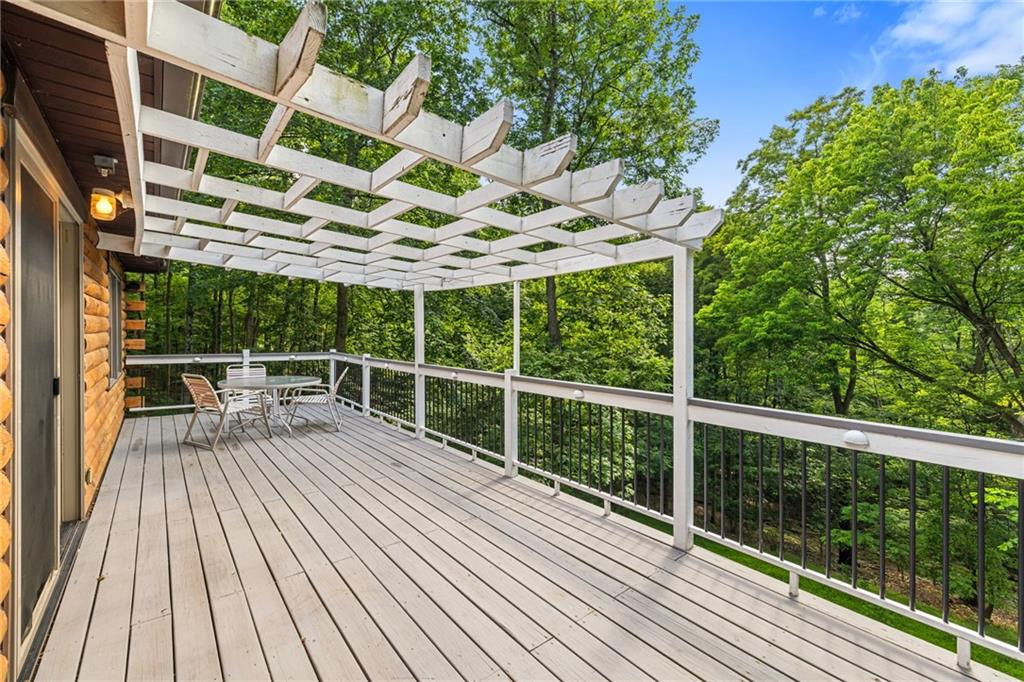 1335 Alamae Lakes Road Washington, PA 15301 - Photo 32 of 50 a view of roof deck with a table and chairs