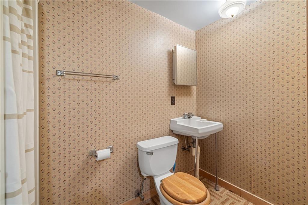 1335 Alamae Lakes Road Washington, PA 15301 - Photo 41 of 50 a bathroom with a toilet a sink and mirror