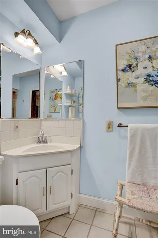 a dining room with wooden floor and breakfast area