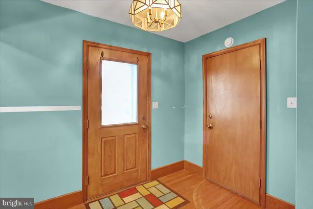 a view of a garage with rack and bicycle
