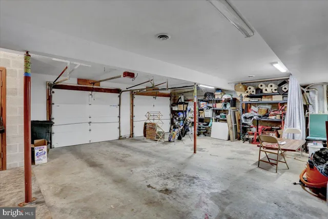 a living room with furniture a ceiling fan and a window