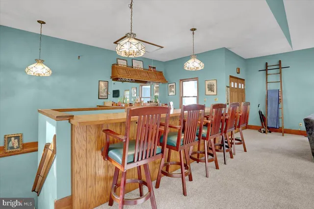 a bedroom with a bed table and a window
