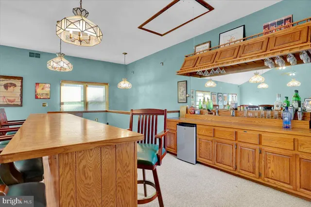 a bedroom with a bed wooden floor and window