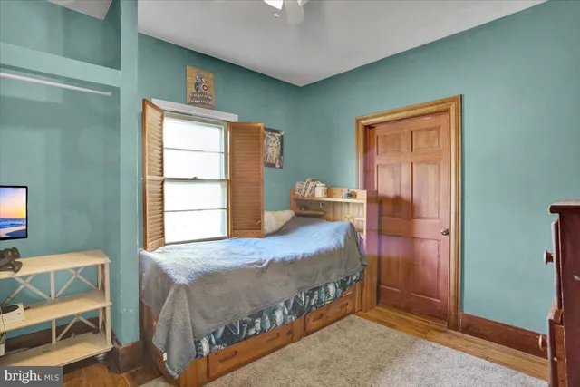 a bathroom with a bathtub a sink and a window