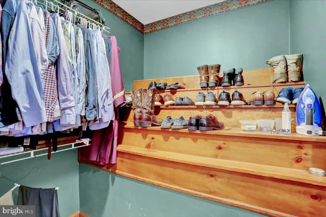 a view of a house with a big yard plants and large trees