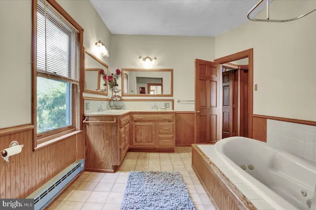 an aerial view of a house with swimming pool table and chairs