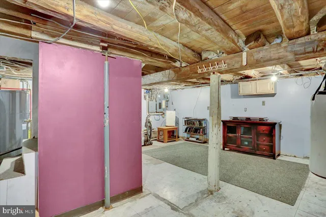 an aerial view of residential house with outdoor space and trees all around