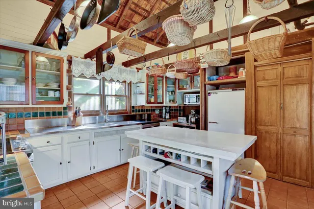a kitchen with stainless steel appliances granite countertop a stove and a sink