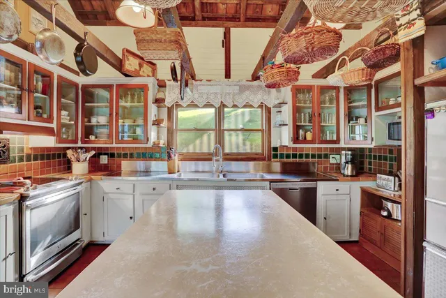 a dining room with furniture window and wooden floor