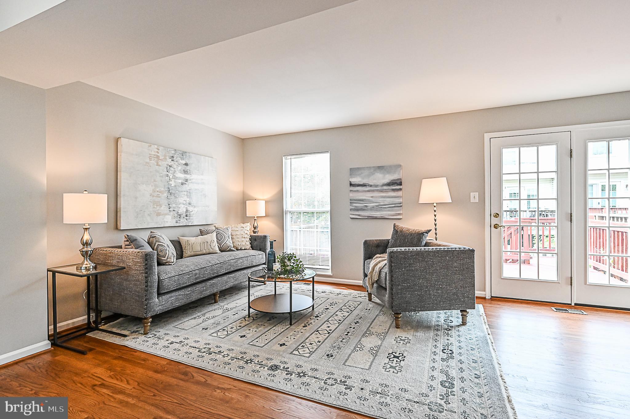 6356 Racetec Place Springfield, VA 22150 - Photo 19 of 51 a living room with furniture and a wooden floor