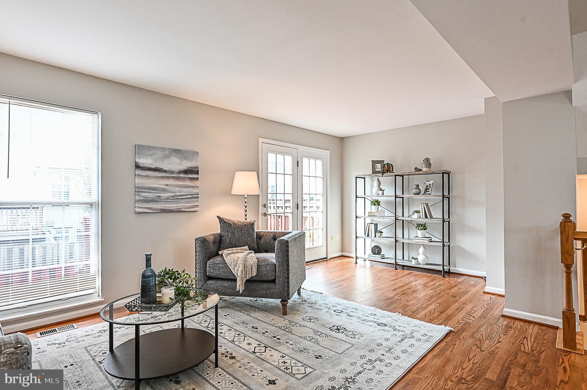 6356 Racetec Place Springfield, VA 22150 - Photo 20 of 51 a living room with furniture and a wooden floor