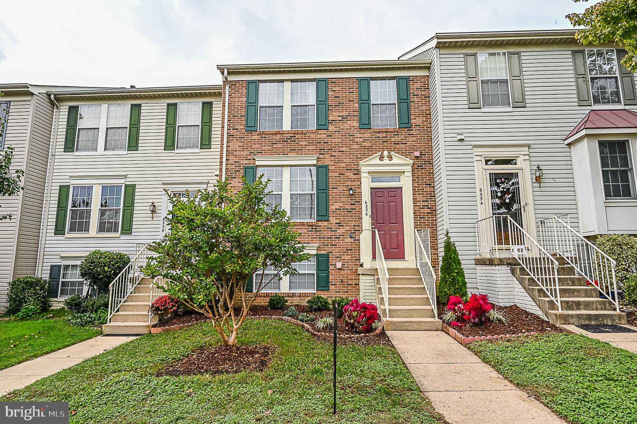 6356 Racetec Place Springfield, VA 22150 - Photo 2 of 51 a front view of a house with garden