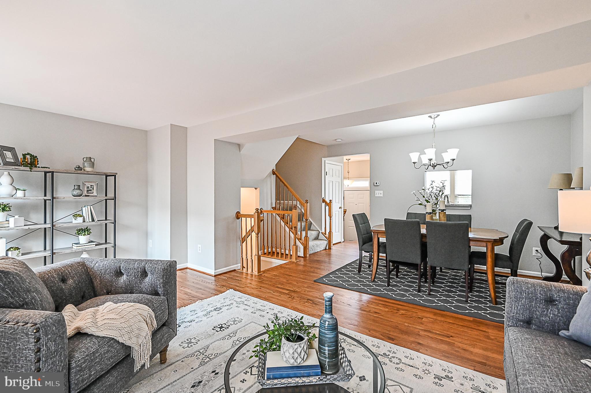 6356 Racetec Place Springfield, VA 22150 - Photo 21 of 51 a living room with furniture and a table