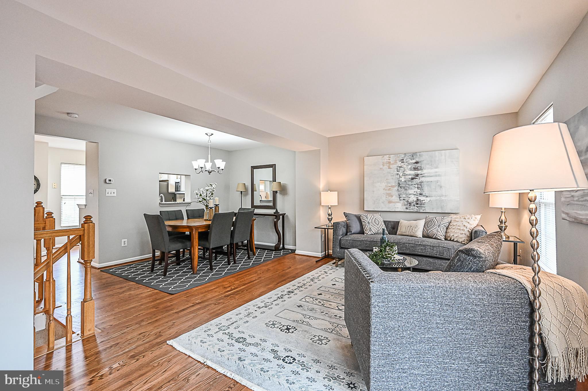 6356 Racetec Place Springfield, VA 22150 - Photo 23 of 51 a living room with furniture and a wooden floor