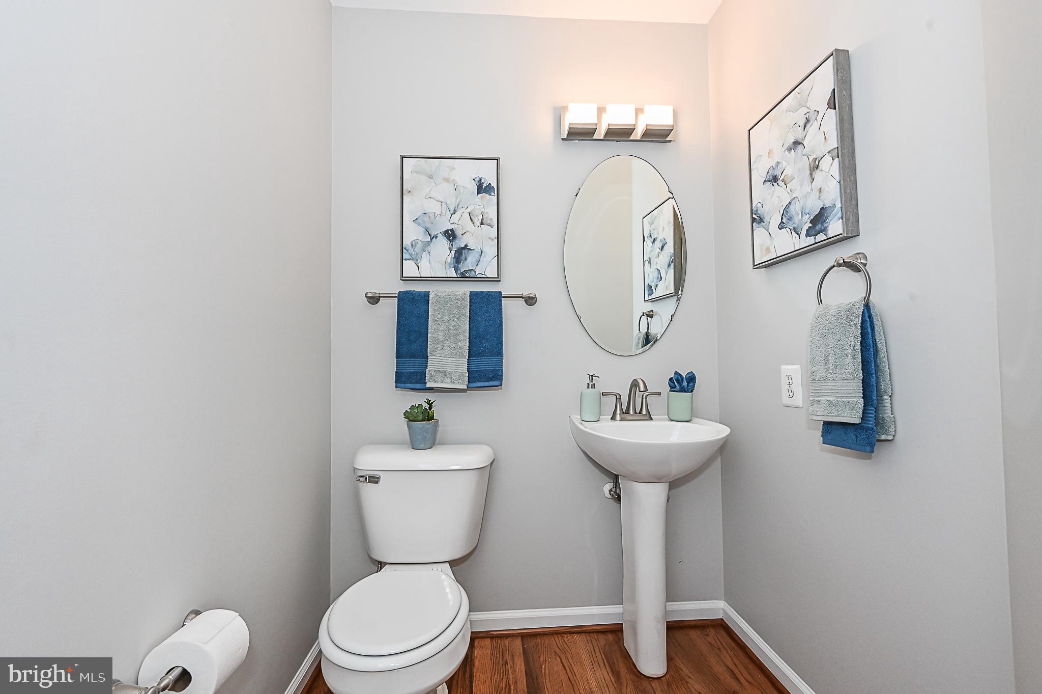 6356 Racetec Place Springfield, VA 22150 - Photo 24 of 51 a bathroom with a toilet a sink and a mirror