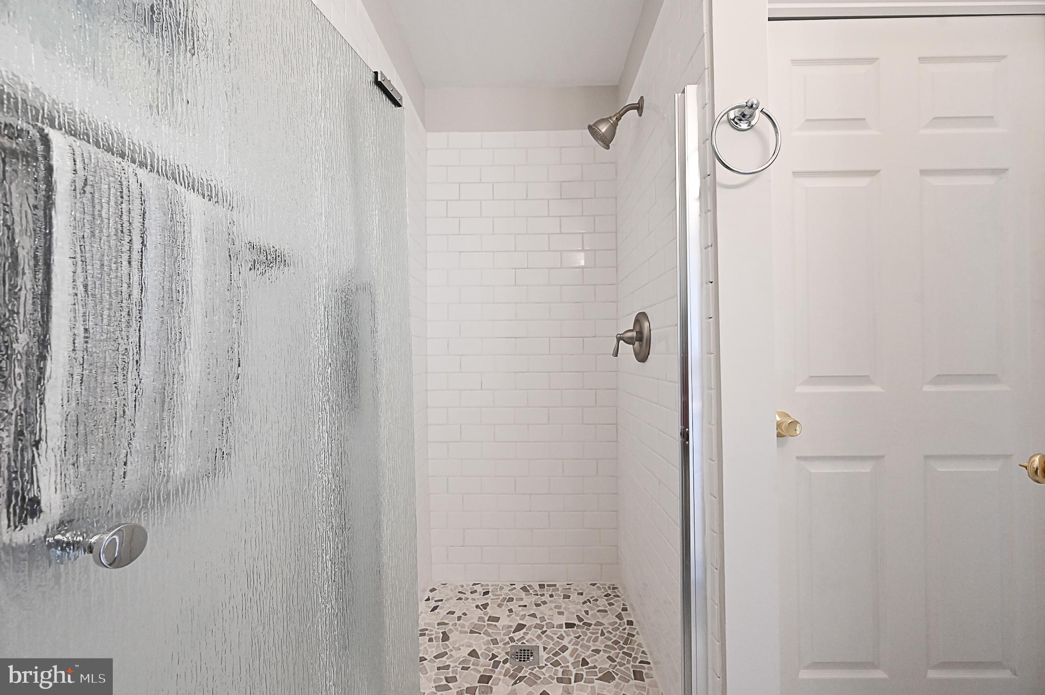 6356 Racetec Place Springfield, VA 22150 - Photo 30 of 51 a bathroom with a shower
