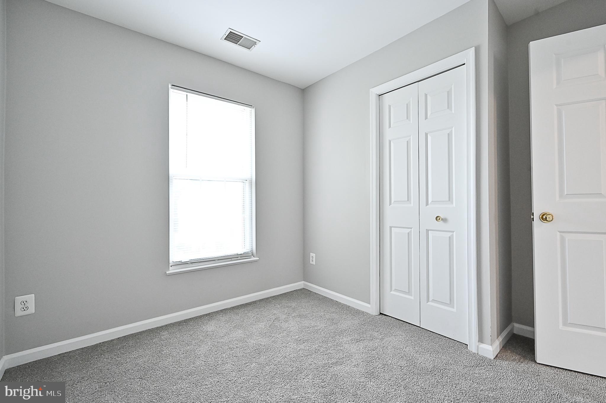 6356 Racetec Place Springfield, VA 22150 - Photo 32 of 51 an empty room with windows
