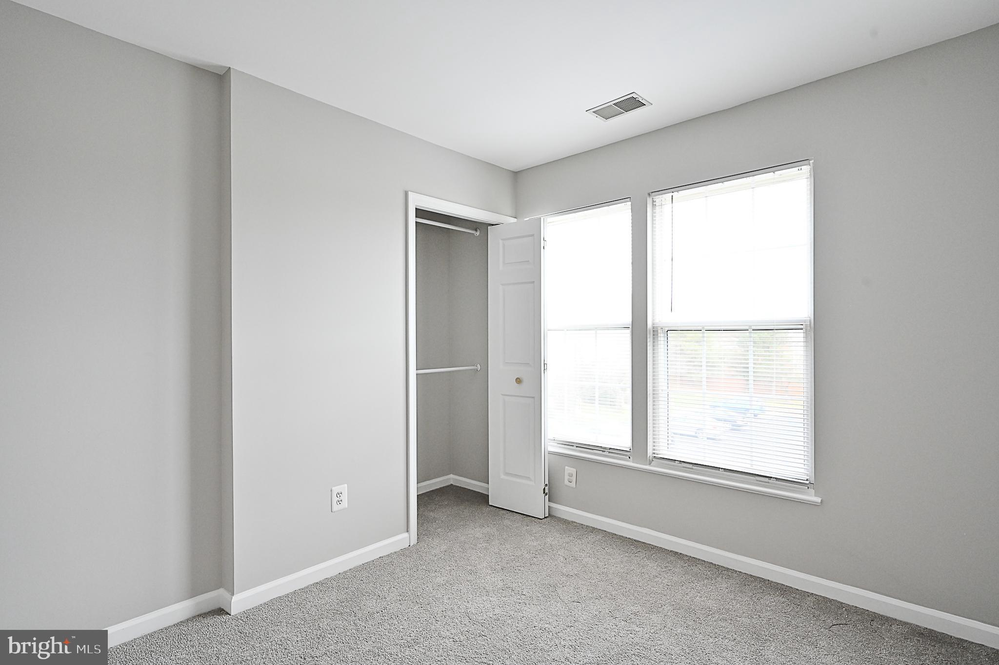 6356 Racetec Place Springfield, VA 22150 - Photo 36 of 51 a view of an empty room with a window