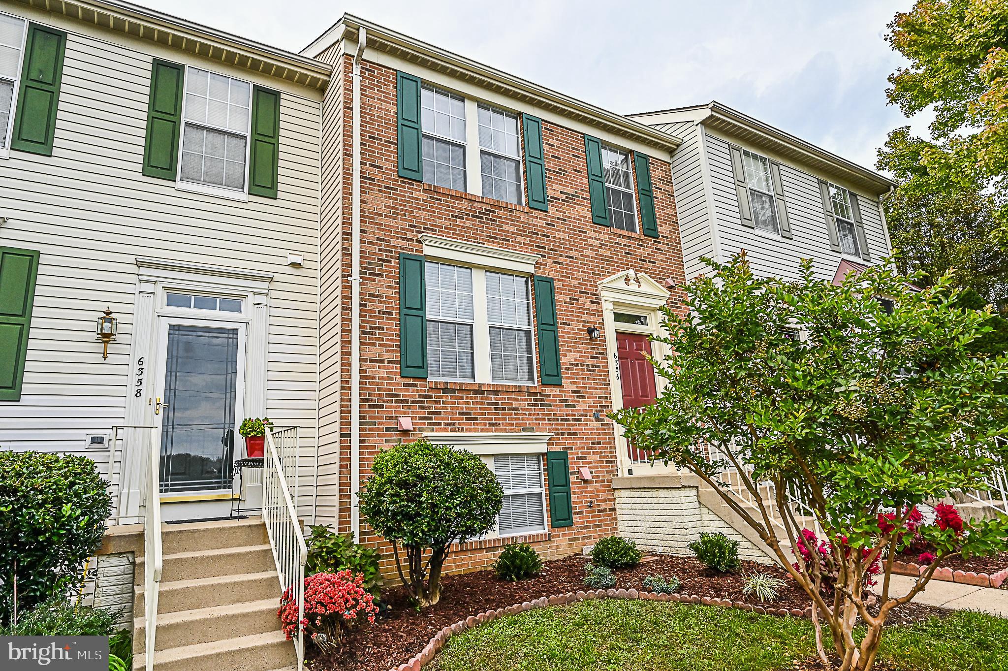 6356 Racetec Place Springfield, VA 22150 - Photo 4 of 51 a front view of a house with a yard