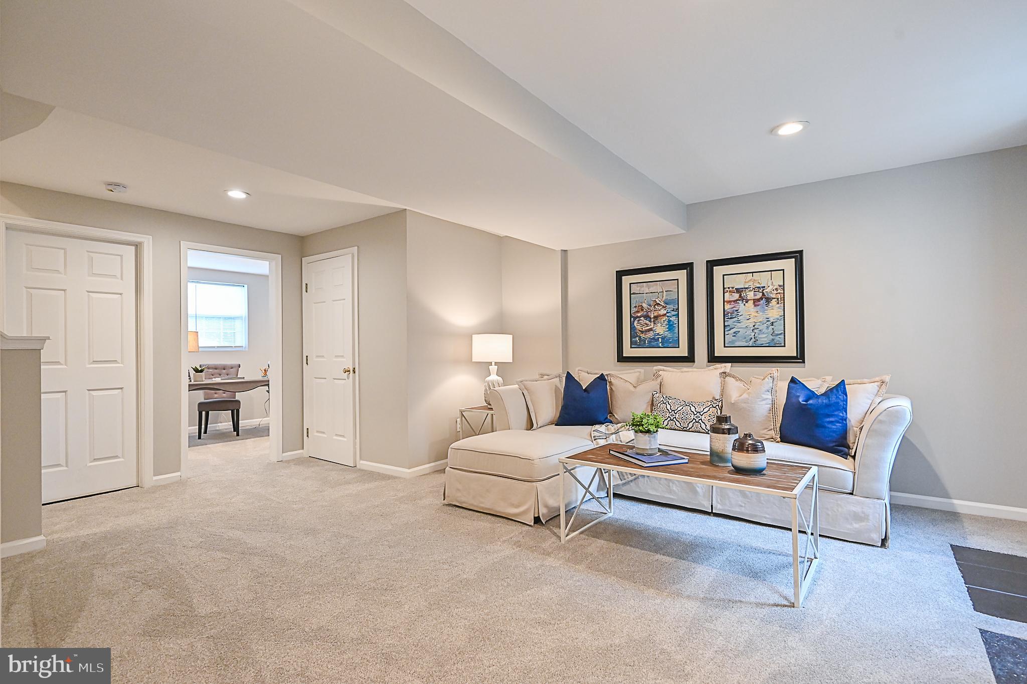 6356 Racetec Place Springfield, VA 22150 - Photo 42 of 51 a living room with furniture and a bathroom