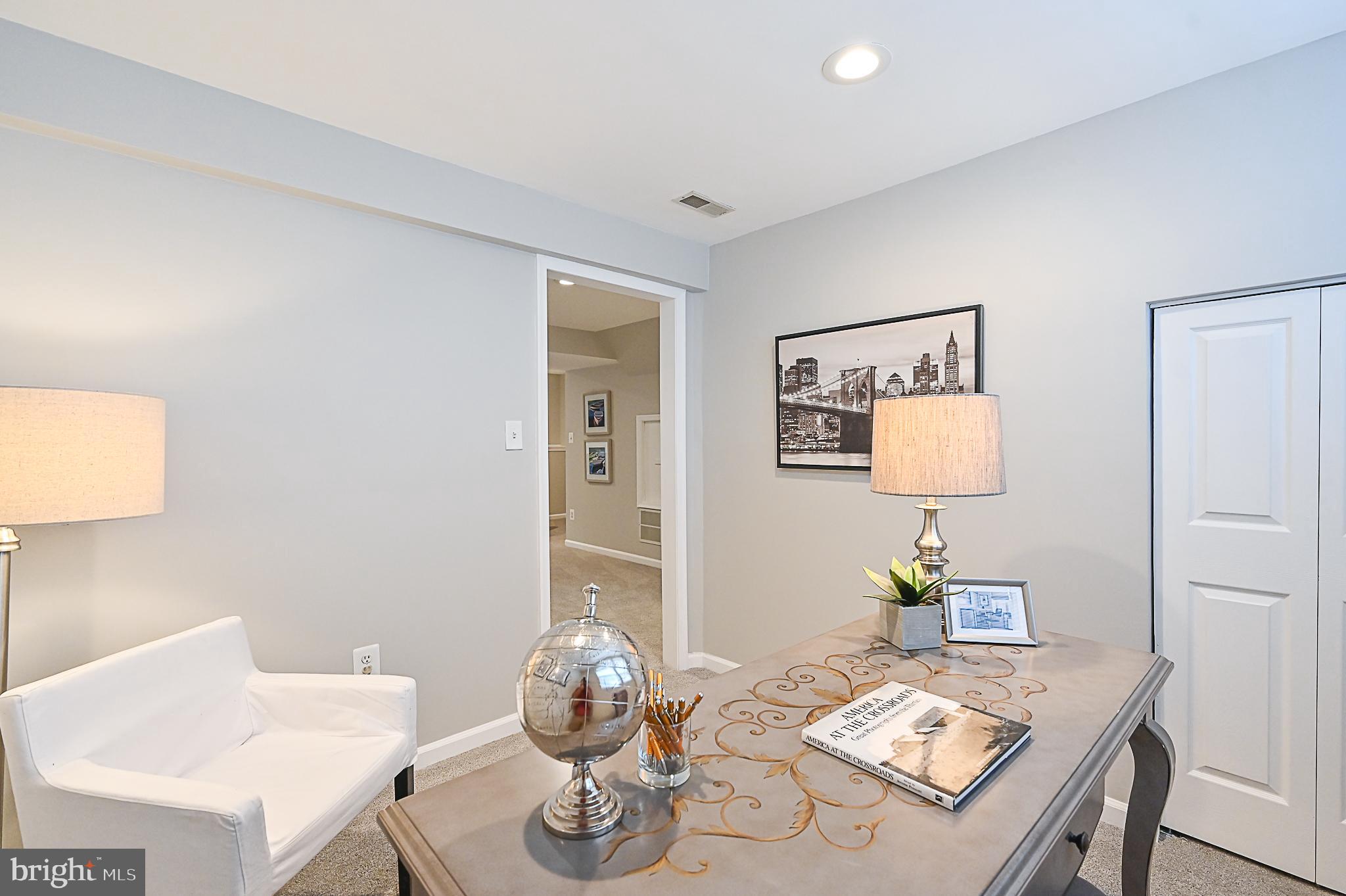 6356 Racetec Place Springfield, VA 22150 - Photo 45 of 51 a living room with furniture and wooden floor