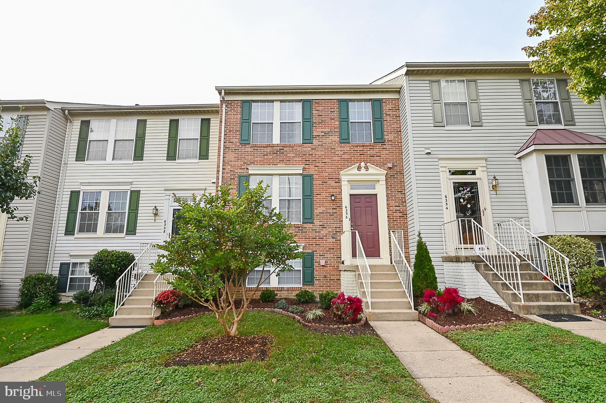 6356 Racetec Place Springfield, VA 22150 - Photo 48 of 51 a front view of a house with garden