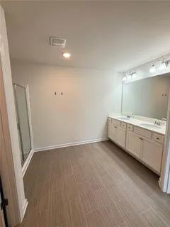a view of a bathroom with sink and mirror