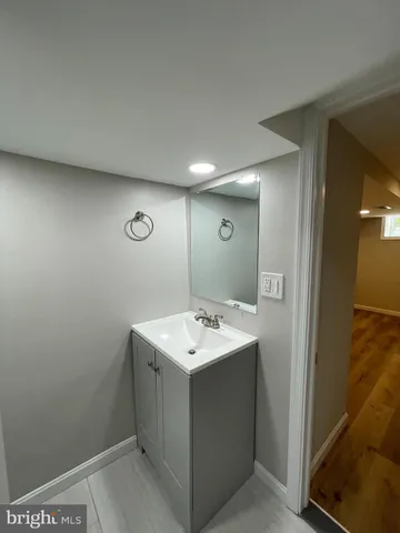 a bathroom with a sink toilet and vanity
