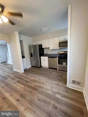 a view of a kitchen with a sink