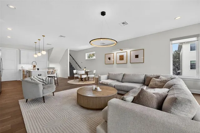 a living room with furniture and white walls