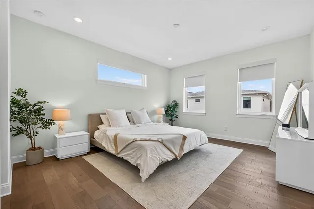 a bedroom with a bed and a couch