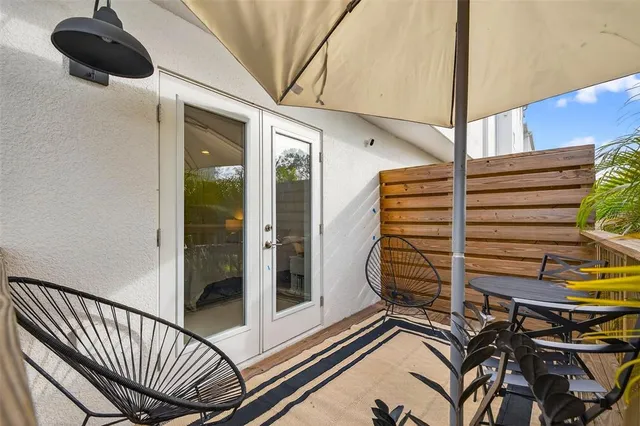 a view of a balcony with a potted plant