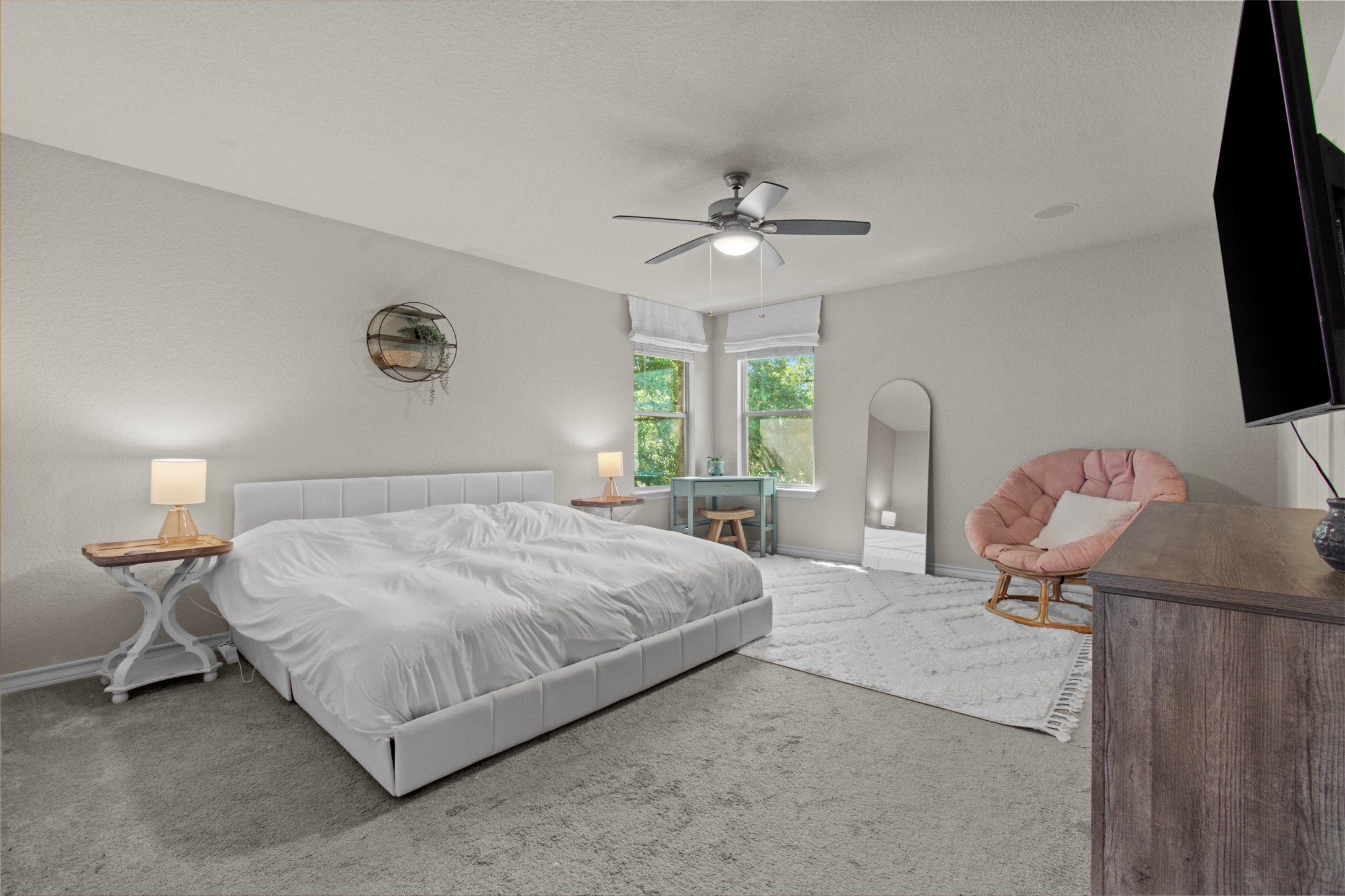 904 American Trail, Unit 2 Leander, TX 78641 - Photo 14 of 29 Oversize primary bedroom with views that overlook the wooded backyard and greenspace.