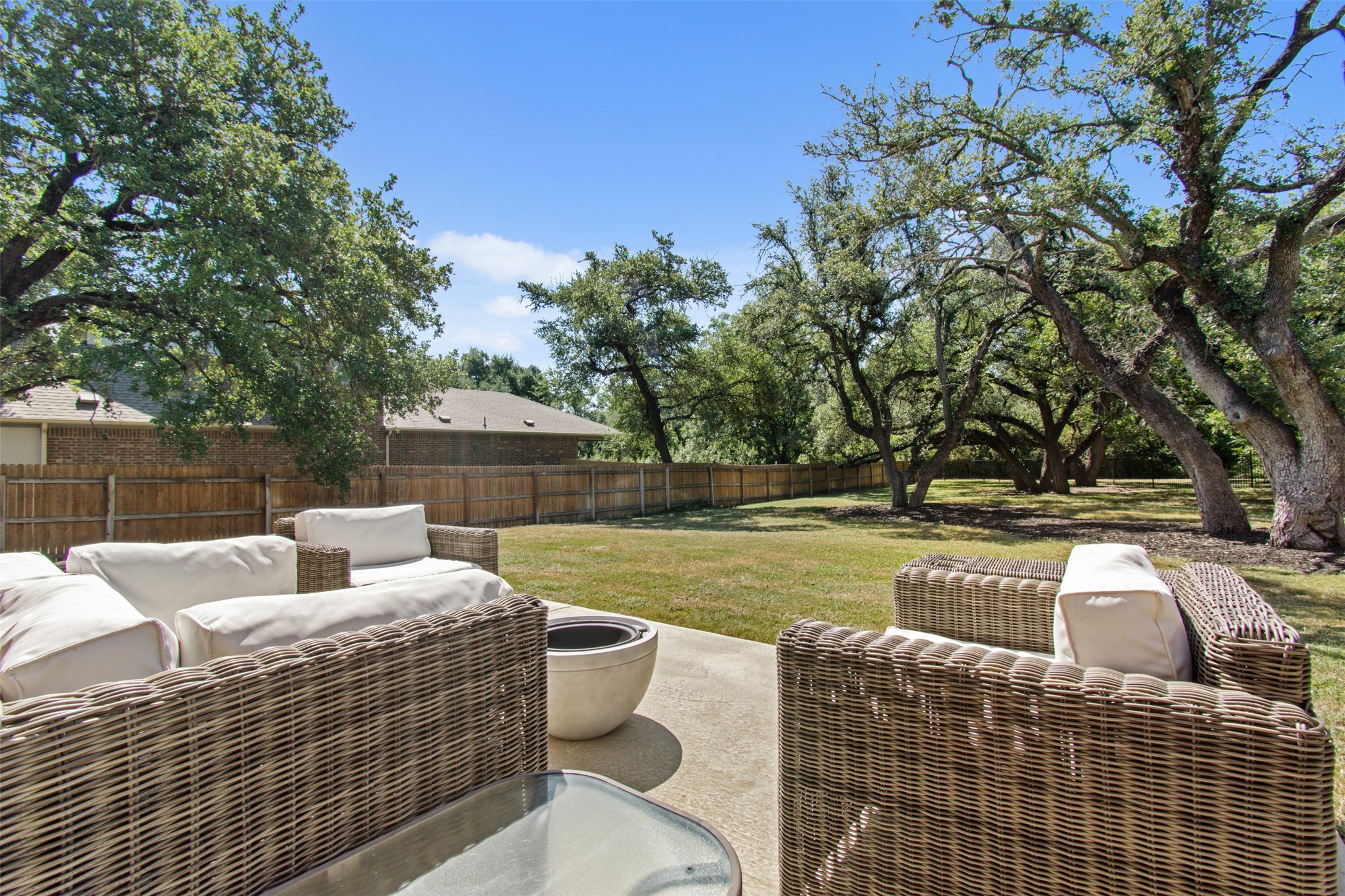 904 American Trail, Unit 2 Leander, TX 78641 - Photo 23 of 29 Fenced backyard with outdoor lounge area and a patio