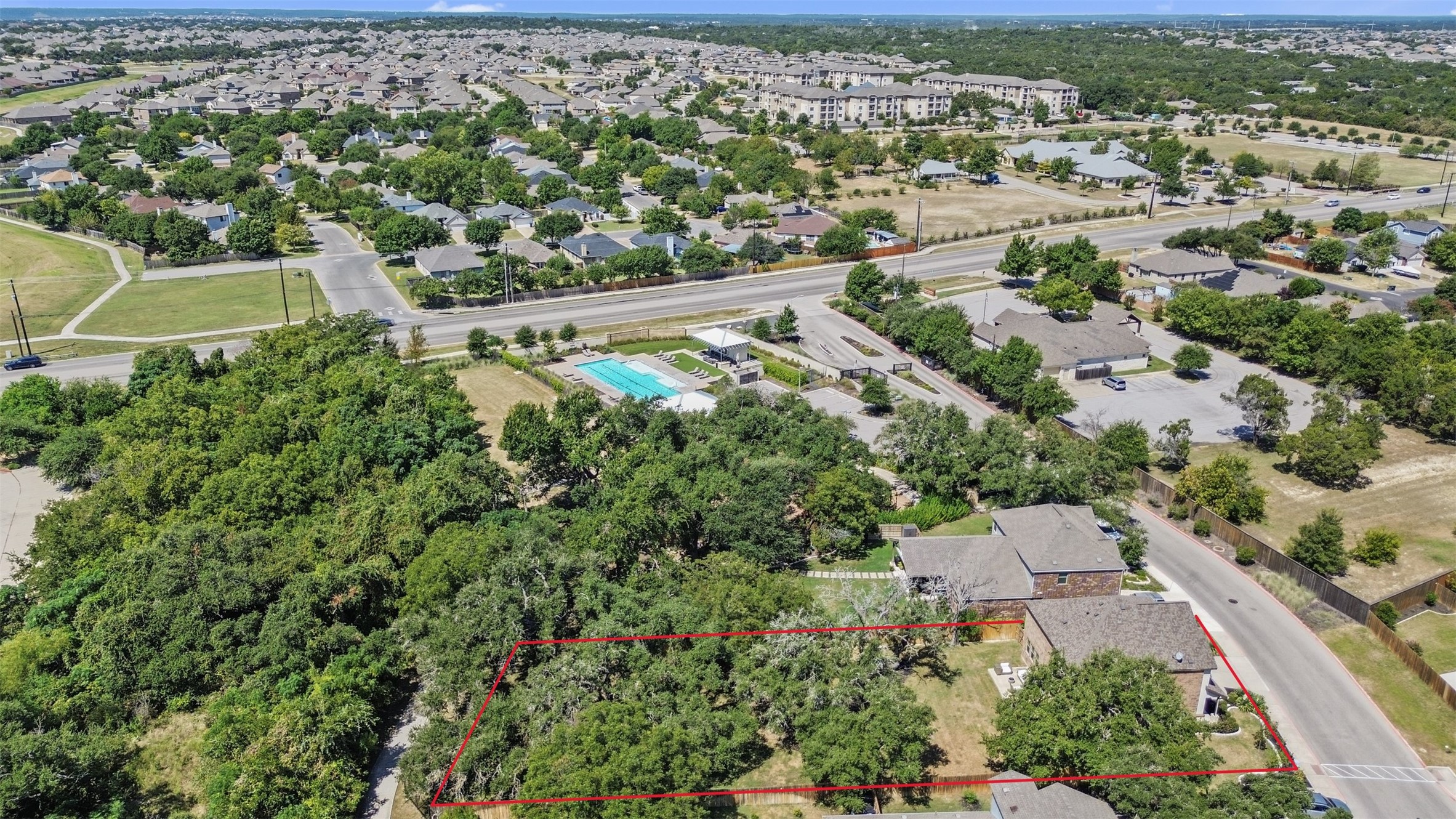 904 American Trail, Unit 2 Leander, TX 78641 - Photo 27 of 29 Aerial perspective of suburban area featuring property boundaries highlighted.
