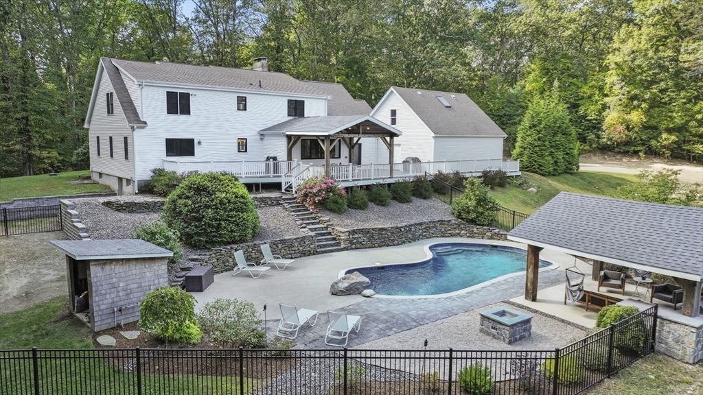 a aerial view of a house with swimming pool