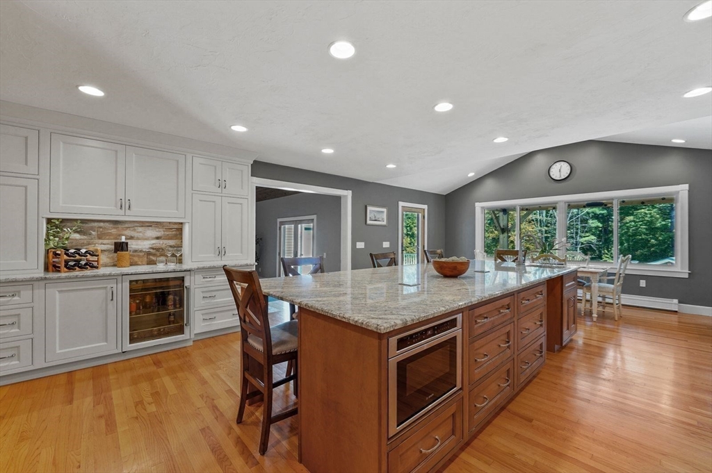 31 Douglas Road Sutton, MA 01590 - Photo 12 of 42 a kitchen with stainless steel appliances granite countertop a stove and a wooden floors