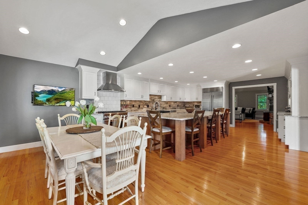 31 Douglas Road Sutton, MA 01590 - Photo 15 of 42 a dining room with lots of furniture and wooden floor