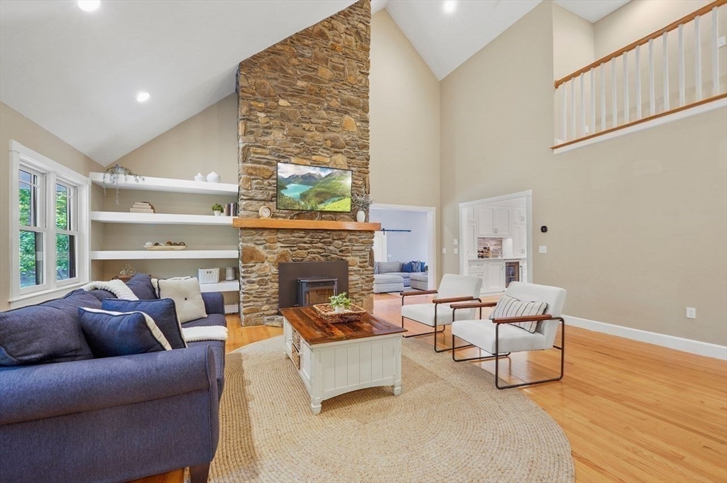 31 Douglas Road Sutton, MA 01590 - Photo 17 of 42 a living room with furniture and a fireplace