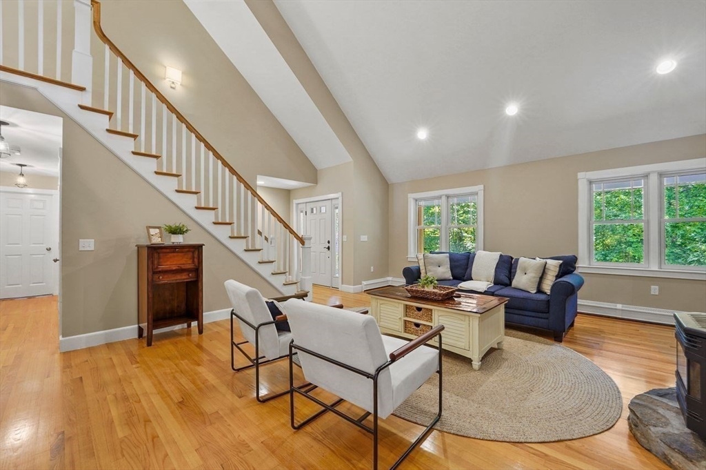 31 Douglas Road Sutton, MA 01590 - Photo 19 of 42 a living room with couches and a dining table with wooden floor