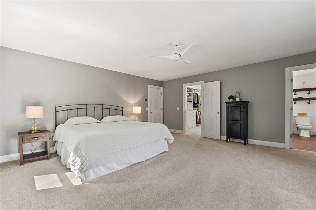 31 Douglas Road Sutton, MA 01590 - Photo 21 of 42 a spacious bedroom with a bed and walk in closet