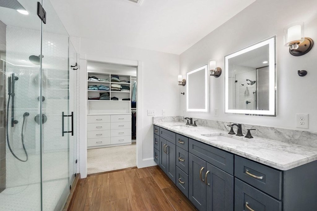 31 Douglas Road Sutton, MA 01590 - Photo 23 of 42 a bathroom with a granite countertop sink mirror and shower