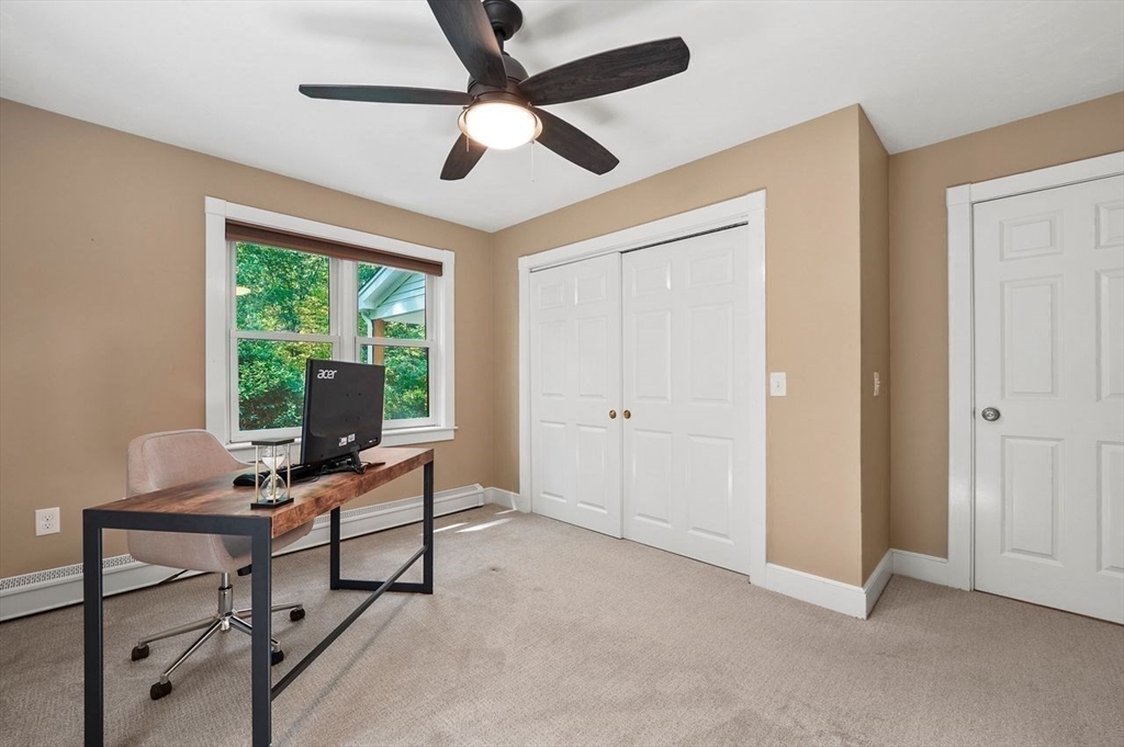 31 Douglas Road Sutton, MA 01590 - Photo 24 of 42 a view of a workspace with furniture and a window
