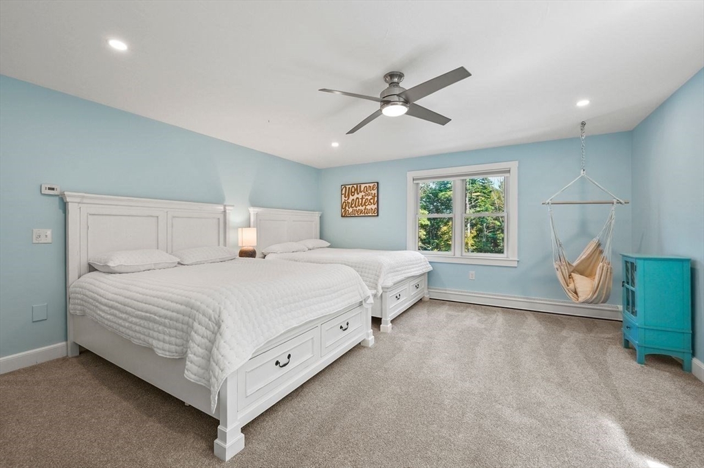 31 Douglas Road Sutton, MA 01590 - Photo 26 of 42 a bedroom with a bed and window