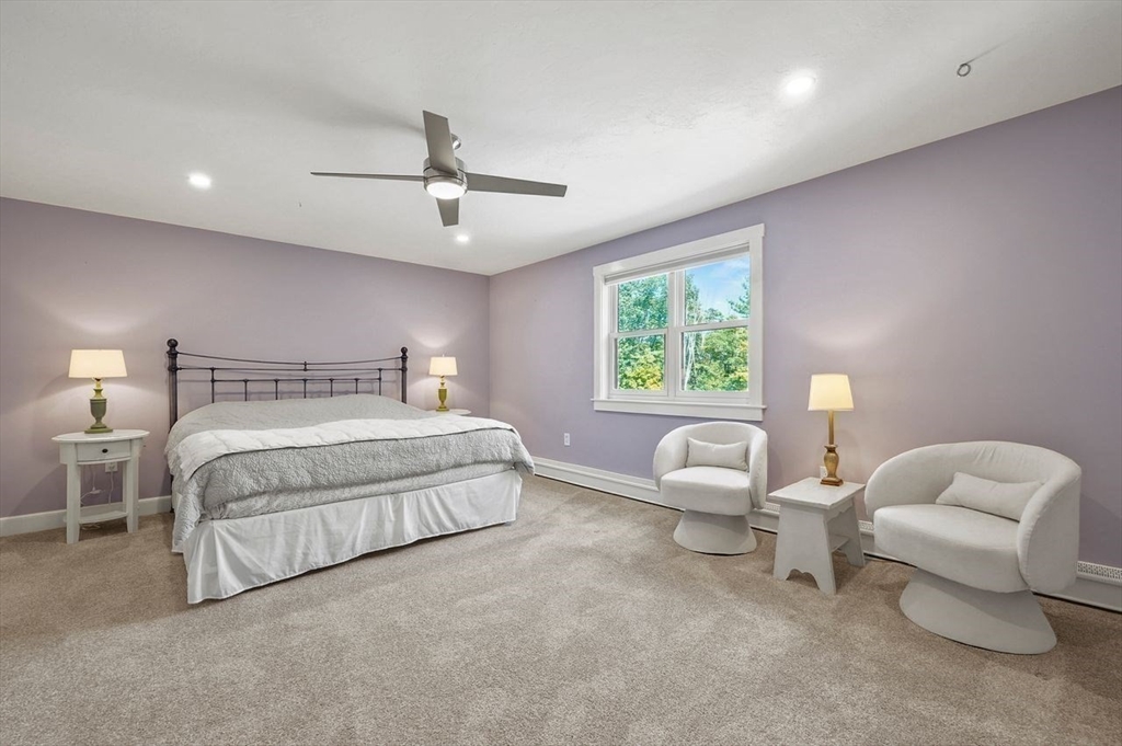 31 Douglas Road Sutton, MA 01590 - Photo 28 of 42 a spacious bedroom with a bed and a couch