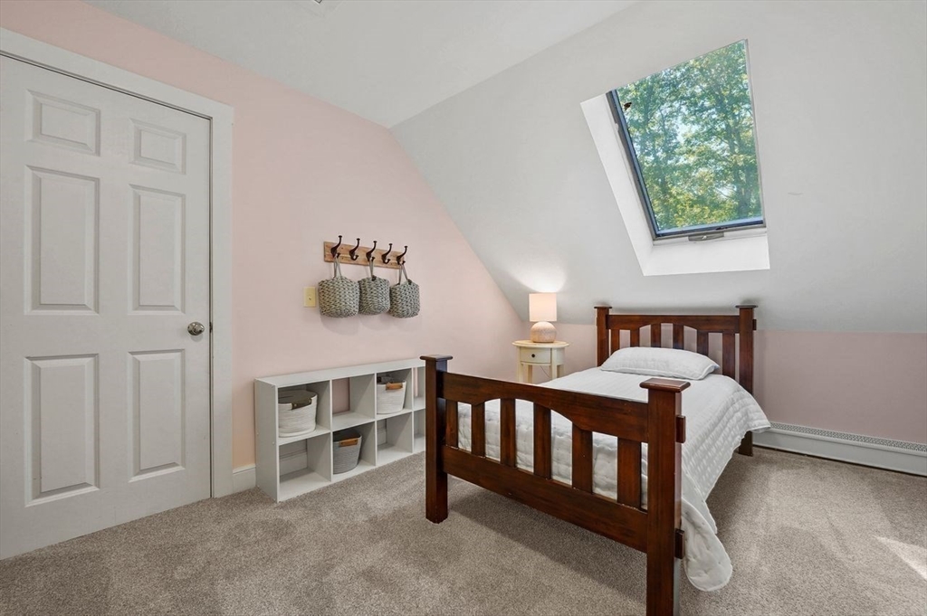 31 Douglas Road Sutton, MA 01590 - Photo 29 of 42 a bedroom with furniture and a window