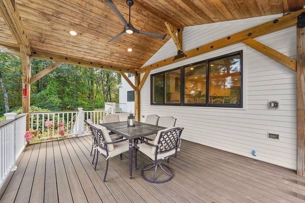 31 Douglas Road Sutton, MA 01590 - Photo 31 of 42 a view of a patio with a table and chairs