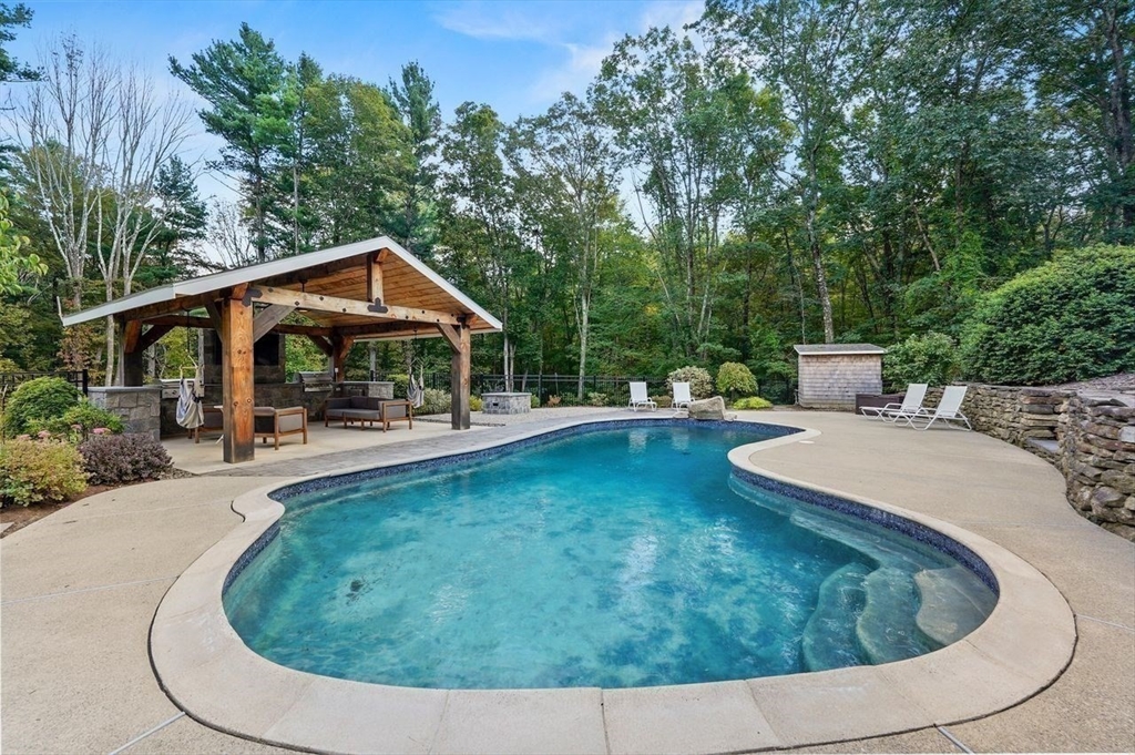 31 Douglas Road Sutton, MA 01590 - Photo 34 of 42 a view of a swimming pool with a patio